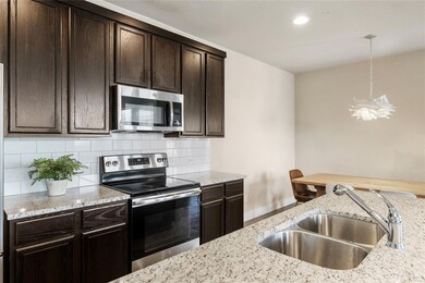 Kitchen with stainless steel appliances, decorati