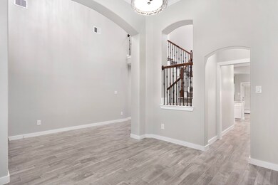 Formal dining room is off of the entry and connects through to the butlers pantry and the kitchen.