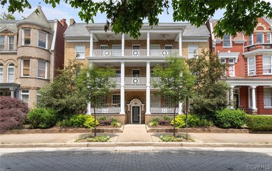 View of front of property with a balcony