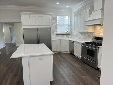 Kitchen featuring a center island, premium range h
