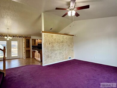 Entry level front room leading into kitchen