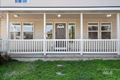 Property entrance with covered porch