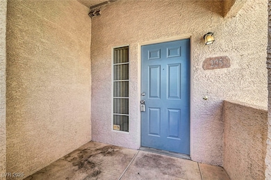 View of exterior entry featuring stucco siding