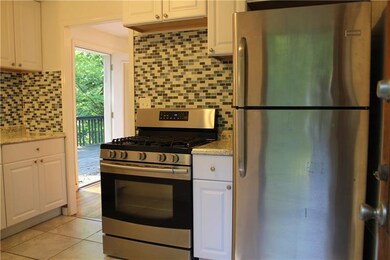 Another view of the kitchen showing the gas range 