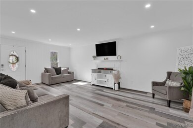 Living room with ornamental molding and light hard