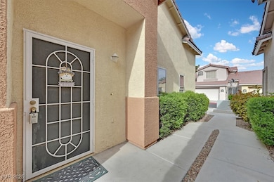 View of exterior entry with stucco siding