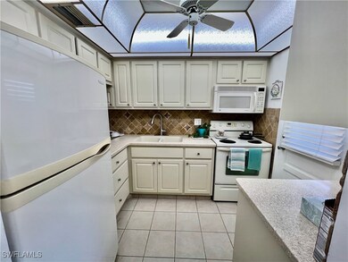 Kitchen with solid surface countertops and stone t