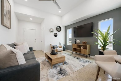 Living room featuring ceiling fan