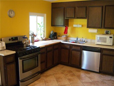 Kitchen with newer convection oven & dishwasher an