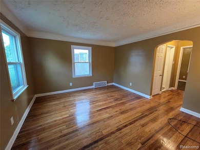 Entering the home right away you see the shining hardwood floors