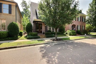 Beautifully landscaped with covered porch!