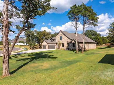 View of front of house with a garage and a front l