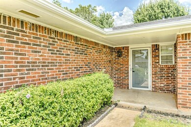 Doorway to property with brick siding