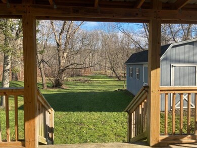 The back yard extends to the Ludlowville Falls Par