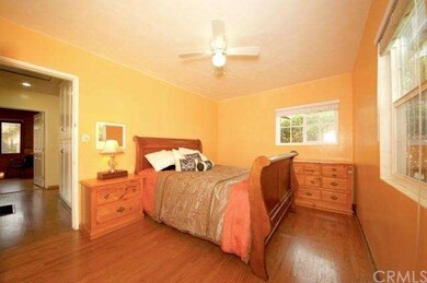 Bedroom one (note the scraped ceiling, ceiling fan