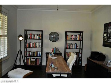 Living Room. the present owners use the living room with French doors to the foyer as a study.
