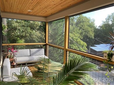 Large screened in porch sits high and offers private setting.