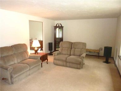 Living Room. The living room is very spacious and opens to the dining room for ease of entertainment.