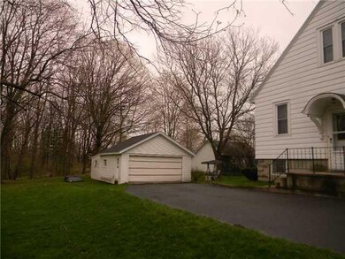 Exterior Front. Black top driveway.2-car New garag