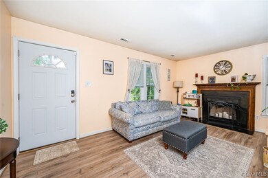 Living room with view of front entry to home and W