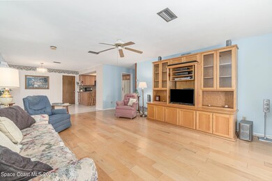 Living Room looking into Kitchen and Din