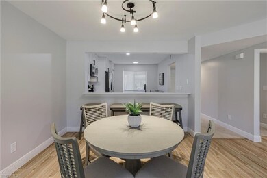 Dining room featuring light wood-type flooring, si
