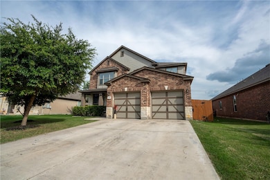 View of front of home with brick siding, a front 