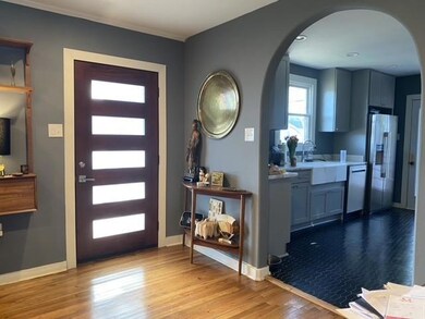 Refinished wood flooring, widened entrance to kitc