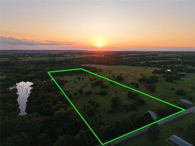 Aerial view at dusk of property parcel outlined, a rural view, and a water view