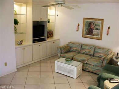 Den with custom wall unit.  Pull-out couch.