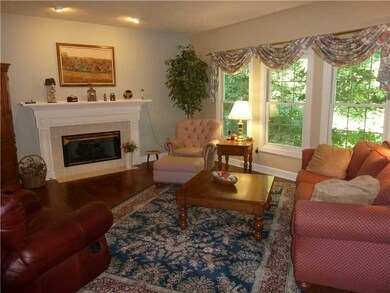 Hearth Room. You  LOVE this room: Fireplace, Beautiful New Flooring & Wall of Windows