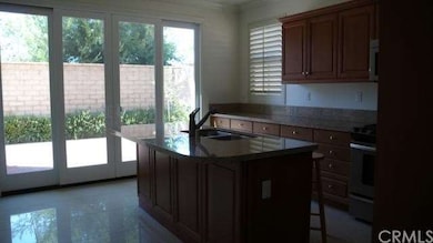 Double sliding glass doors open to large side yard