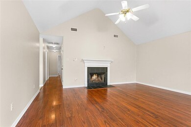 Spacious living room with wood burning fireplace a