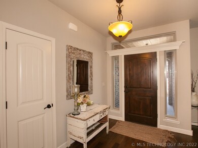 Lovely hardwood door and covered entry on front po