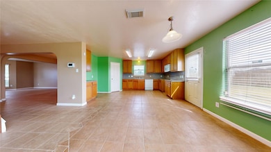 Kitchen, breakfast area and dining space.