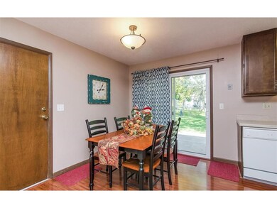 Dining room is open to kitchen and living room wit
