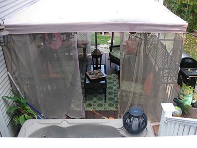 Exterior Back. Screened outdoor Gazebo and multi-l