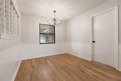 Spare room with a textured ceiling, a notable chan