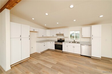 Kitchen with appliances with stainless steel finis