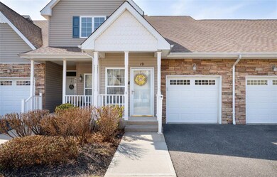 View of front of house featuring a garage, stone s