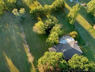 Ariel view of house and yard. 1.15 ac beautifully