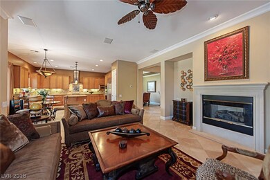 Great room shows ceramic tile, crown moulding, and