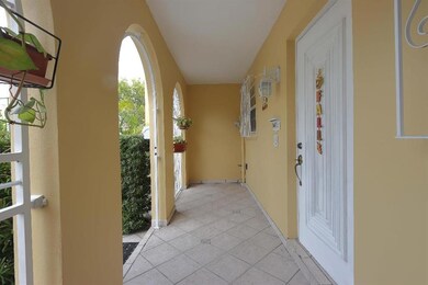 Adorable front patio with a locked gate, also a st