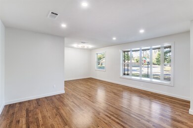 Living room and dining room combination.  Beautiful hardwood floors!