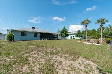 Large screened in lanai and deck overlooking waterway.