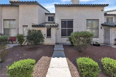 Mediterranean / spanish-style home with a chimney,