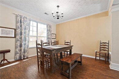 Dining room featuring dark wood finished floors, a