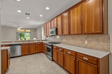 Kitchen has upgraded large cupboards, corian count