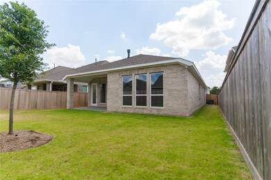 This photo shows a backyard with a well-maintained