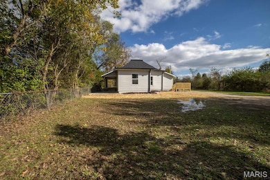Fenced backyard with a deck